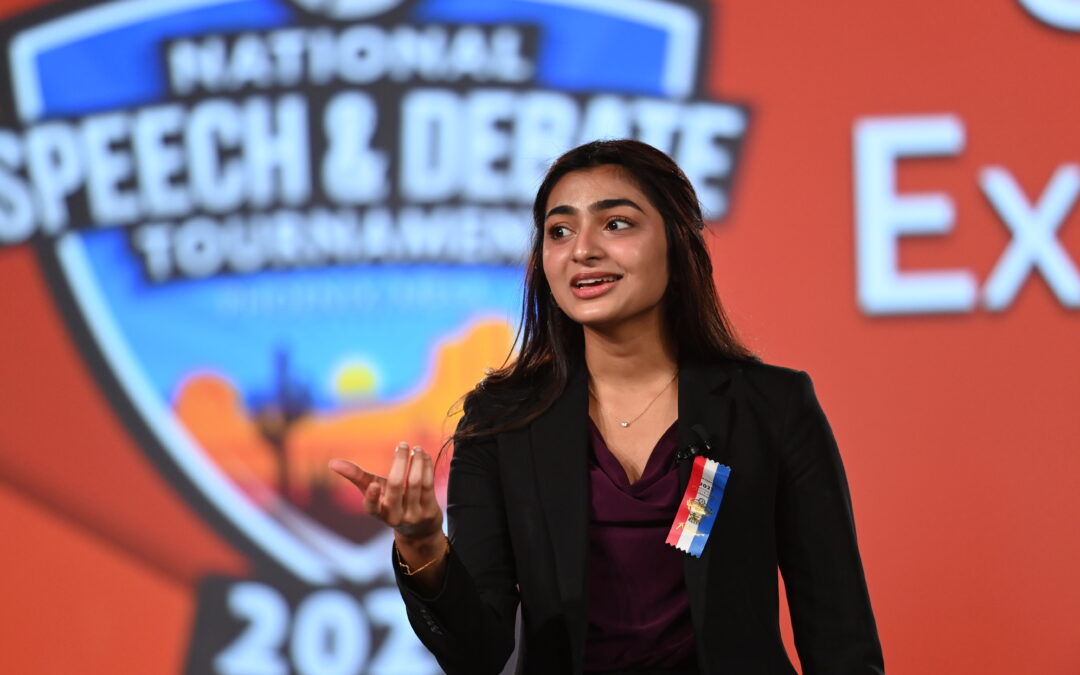 Student speaking on stage at the National Tournament