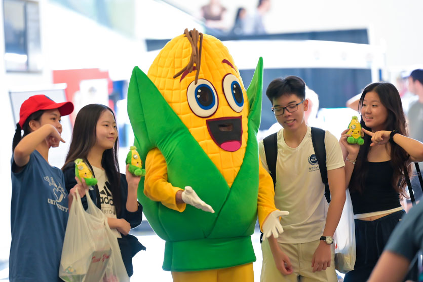 Group of students posing with Cornelius the mascot at the National Touranment