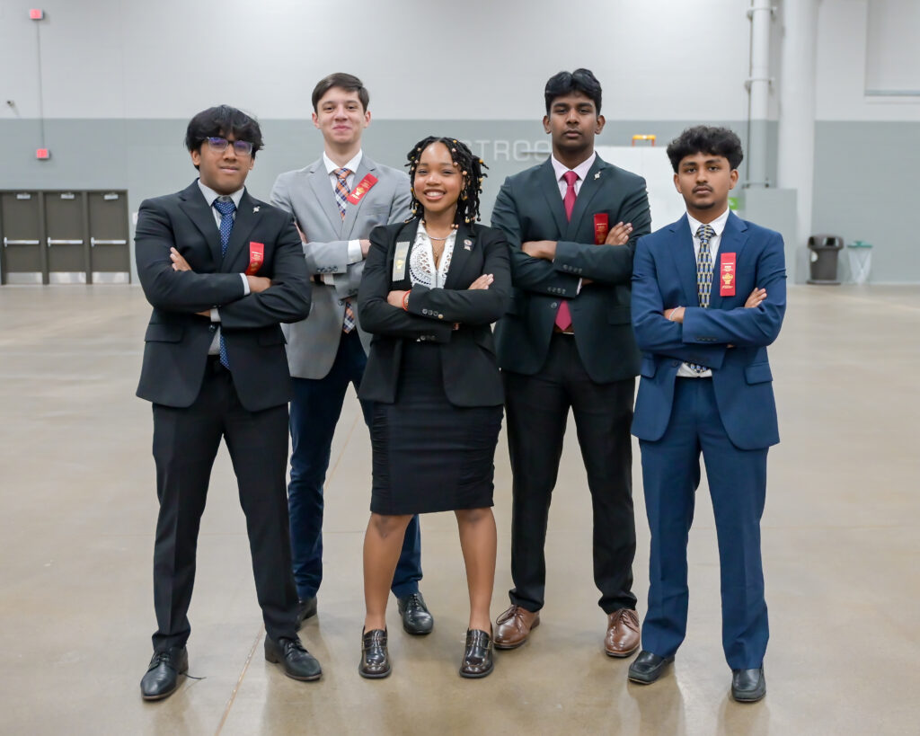 Group of students posing for a photo at a tournament